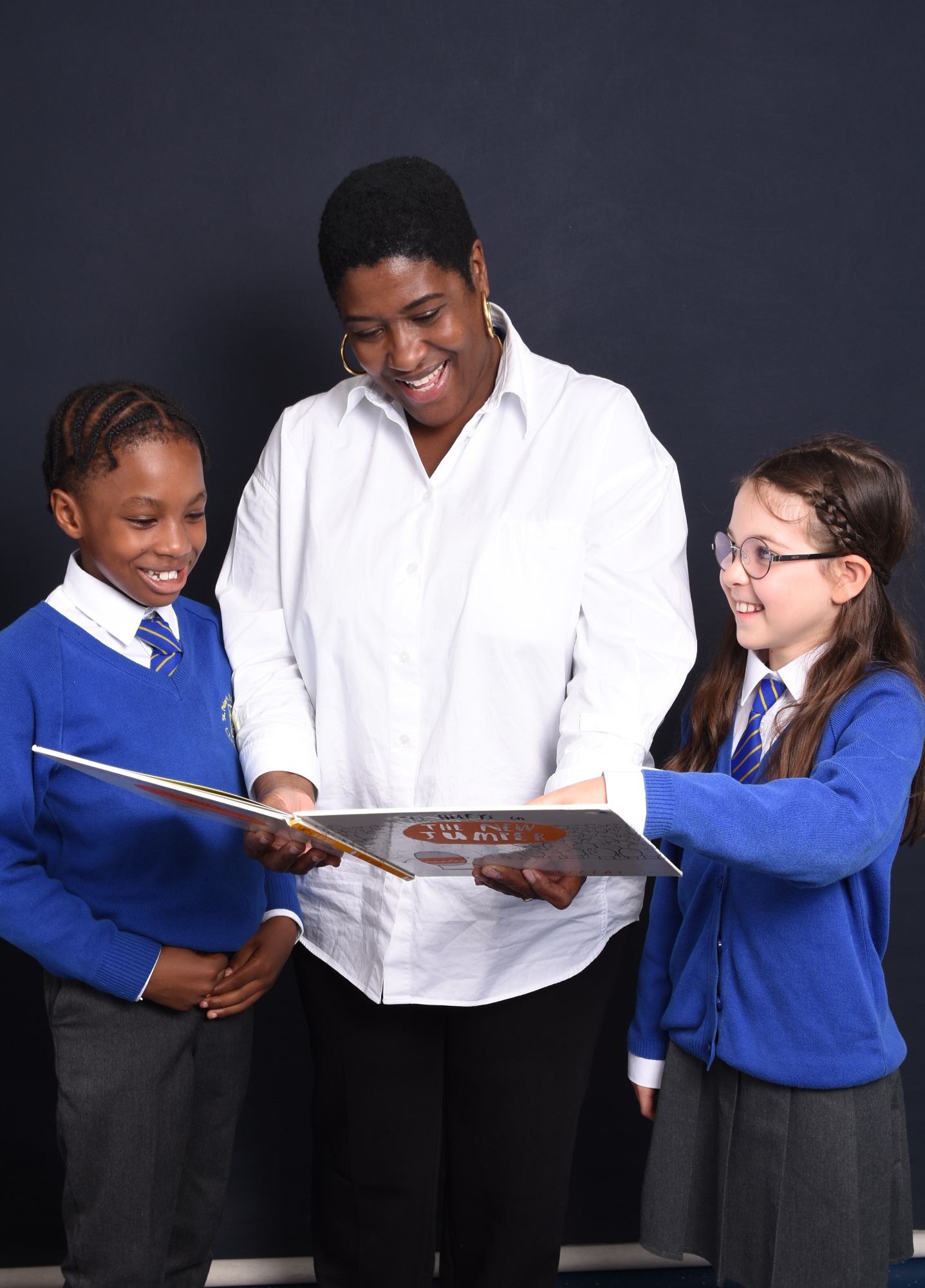 Headteacher reading with pupils